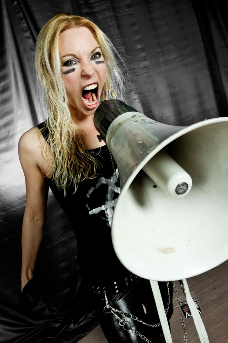Angela Gossow using a megaphone