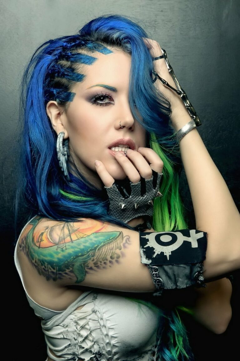 A picture of Alissa White-Gluz cradling her face