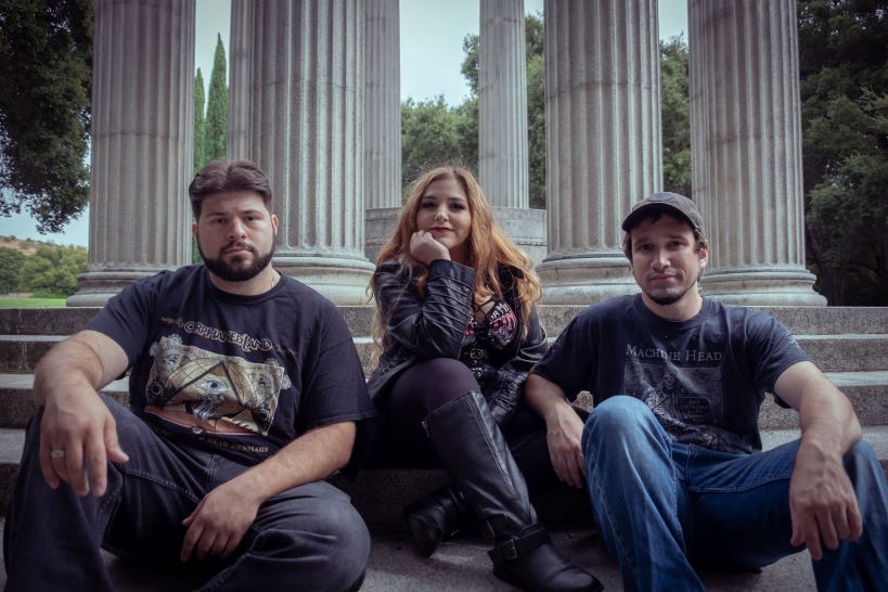 Picture of Lokheira band sitting on some steps outside